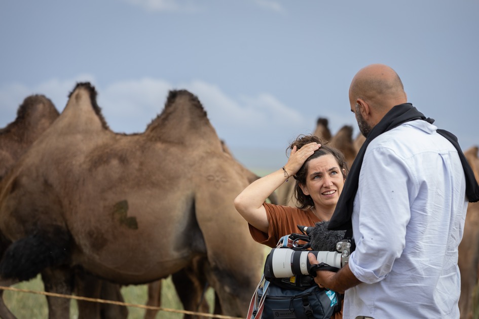 Caravan film crew in discussion